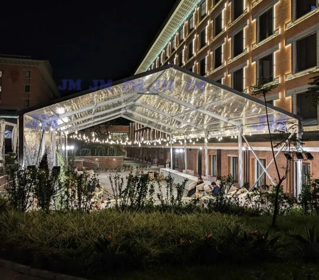 Clear roof marquee hire at a hotel courtyard with string lights