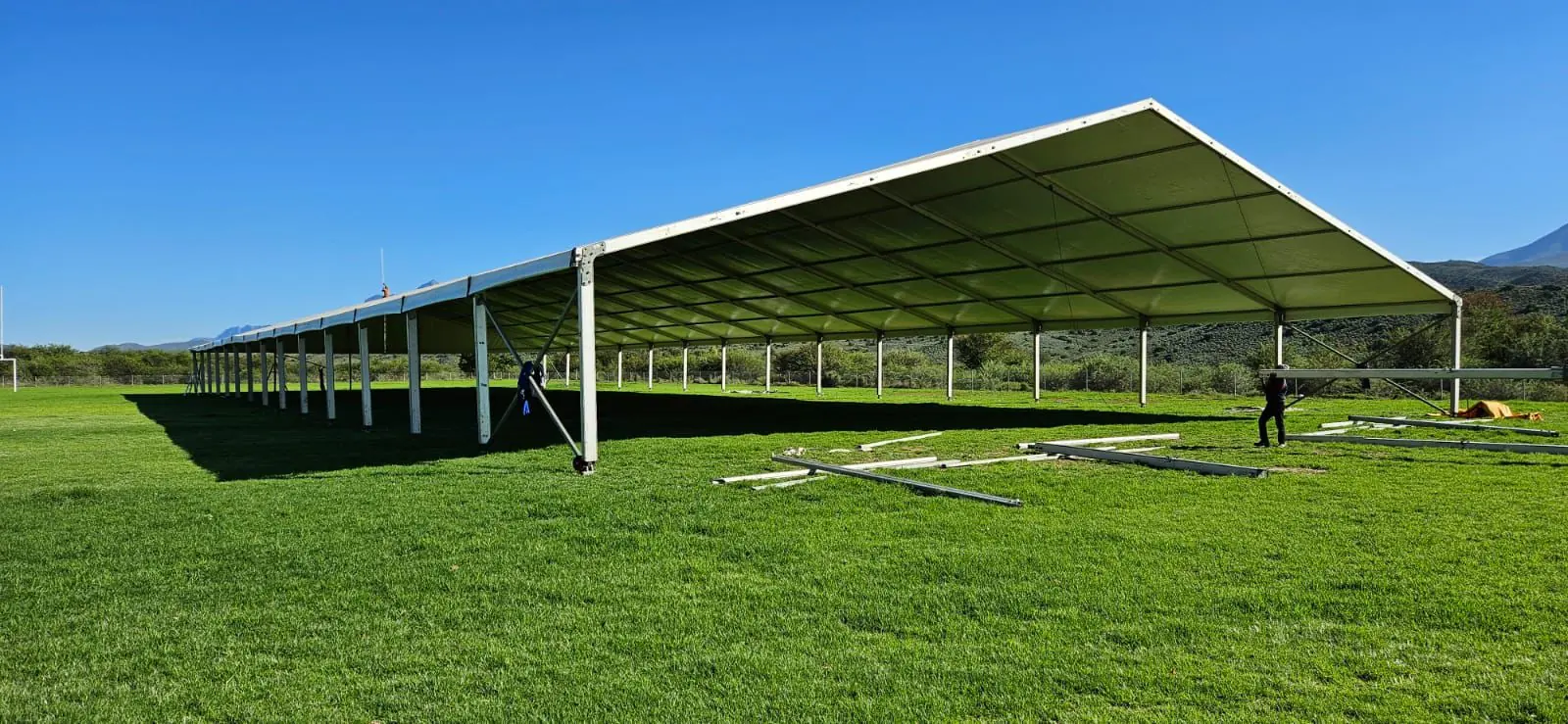 Large open-sided marquee on a grass field