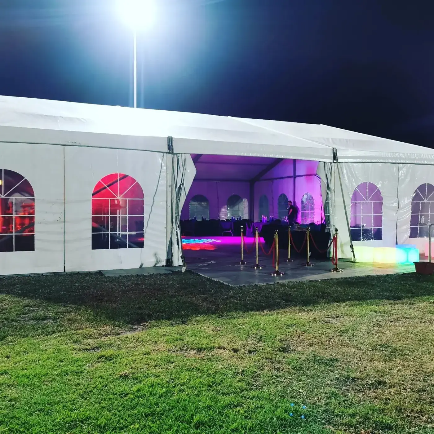White marquee tent hire with event lighting at night in Gauteng